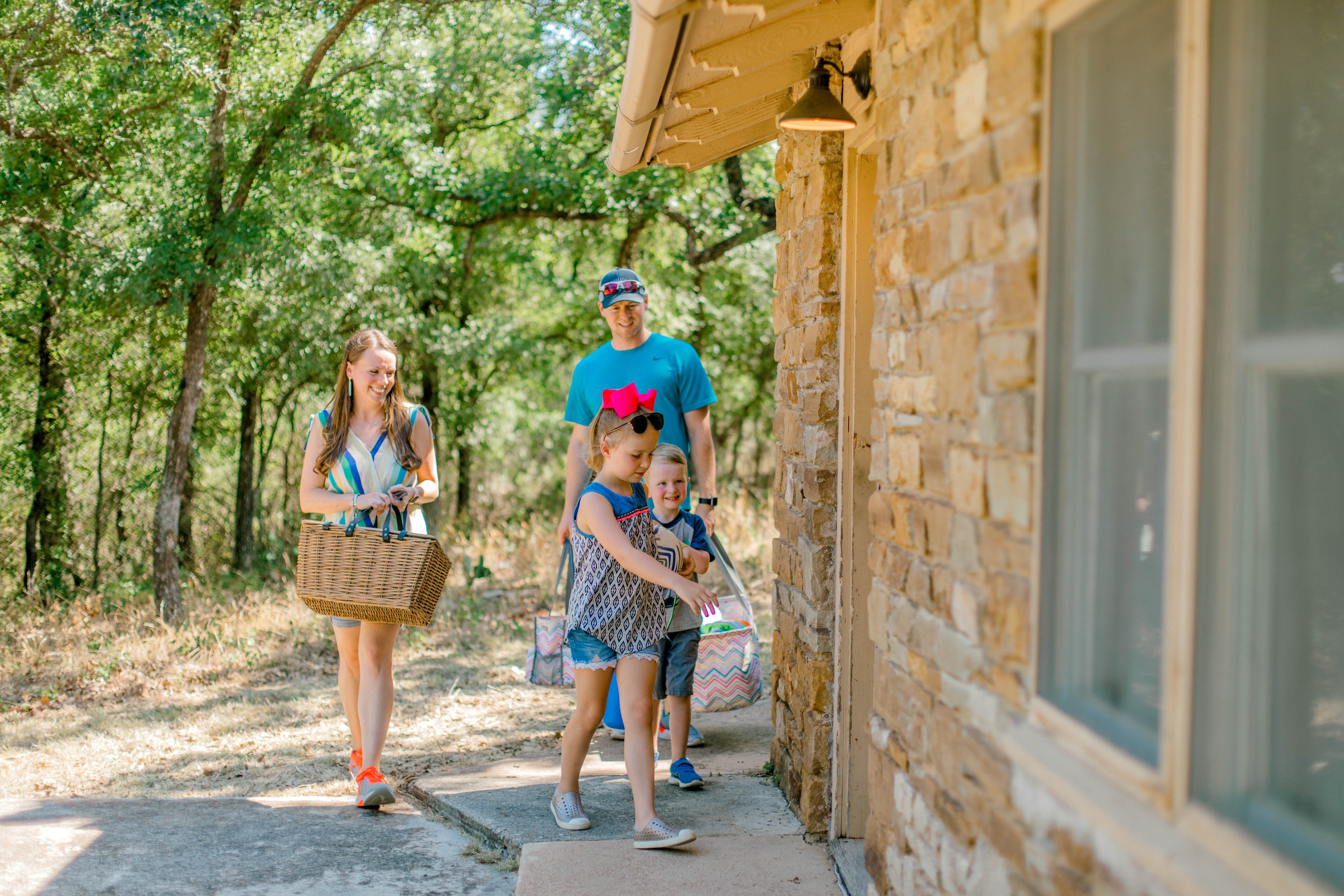 family entering cabin at state park