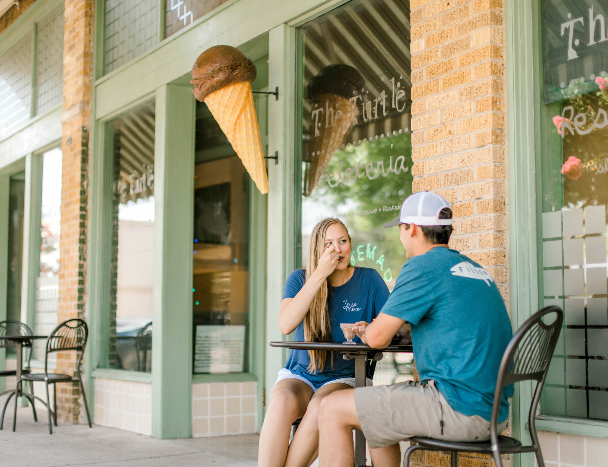 couple eating ice cream at a downtown shop